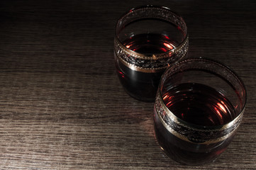 Glass of dark red whiskey, brandy or .bourbon