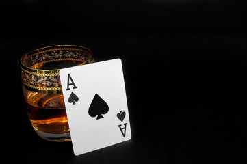 Glass of dark red whiskey, brandy or .bourbon