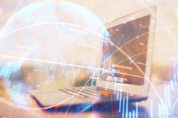 Stock market chart hologram drawn on personal computer background. Multi exposure. Concept of investment.