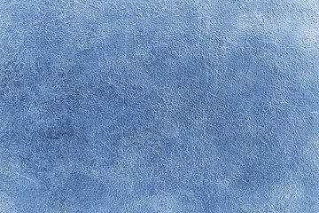 Blue spotted scratched stucco background closeup, rough cement texture backdrop, concrete grunge textured wall, decorative art silver plaster board, light blue aged vintage wallpaper, blank copy space