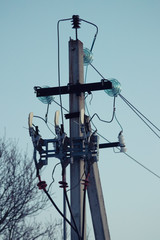 Electric pole with wires and power equipment