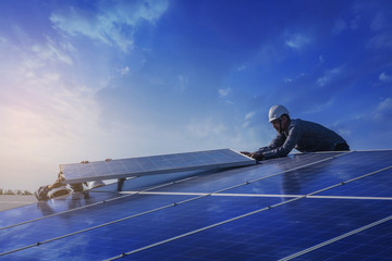 Electrical and instrument technician worker replace and maintenance electric system at solar panel...