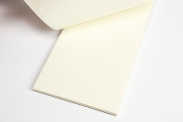 Closeup of opened diary with blank pages isolated on white.