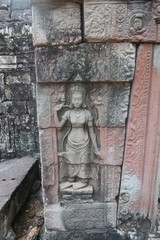 Fototapeta na wymiar vishnu, shiva, hindu god symbol, face in ancient temple ruins of angkor wat, cambodia, yoga class