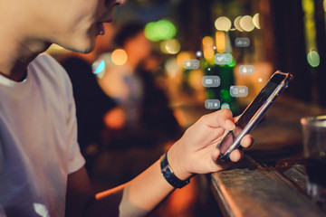 Close up of a business man using cell phone or  smartphone with  icons on train station or subway background ,Businessman using phone ,Social, media, Marketing concept .