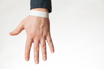 Empty white paper wristband, hospital (resort) bracelet. Empty (copy space) design.