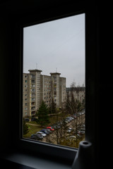 Through the window. A view to old soviet residential houses