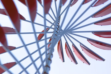 abstract red windmill on a blue sky background 3