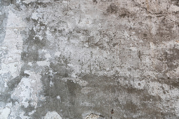 Fototapeta premium The texture of the old concrete wall with scratches, cracks, dust, crevices, roughness, stucco. Can be used as a poster or background for design. Copy space for text message.