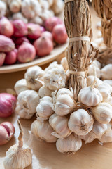 Garlic and shallot or red onion in a wooden dish
