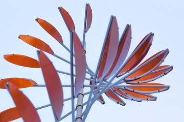abstract red windmill on a blue sky background