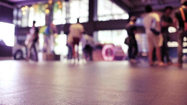 Time lapse of anonymous crowd shoppers inside a modern busy shopping mall complex. Consumerism concept