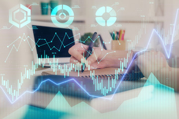 Financial graph displayed on woman's hand taking notes background. Concept of research. Double exposure