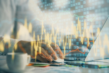Double exposure of forex graph with man working on computer on background. Concept of market analysis.