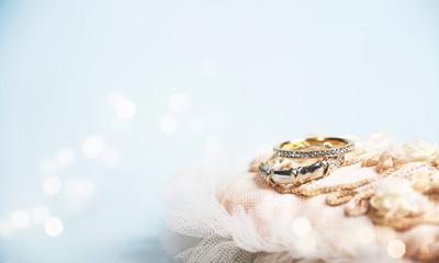 Wedding ring on the vintage lace pillow