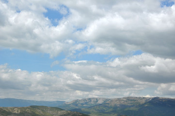 Beautiful clouds on a blue sky in the mountains. Crimean mountains