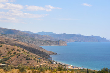 Fototapeta na wymiar Beautiful view of the sea and mountains from the shore. Crimea