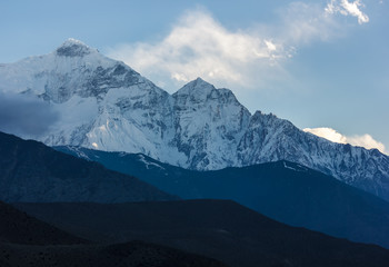 The snow covered Nilgiri North mountain seen from the Himalayan village of Kagbeni in Upper Mustang in Nepal. 