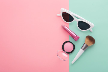 Cosmetic beauty products on pastel color background