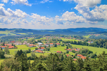 Fototapeta na wymiar Clouds over a green valley in Bavaria.