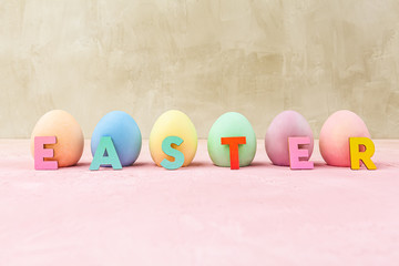 Painted Easter eggs with Easter text letters and copy space