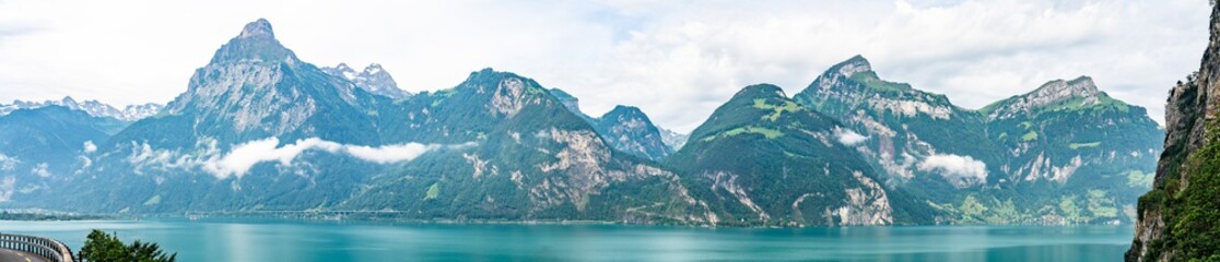 Switzerland, Panoramic view on green Alps and lake near Bauen, Isleten