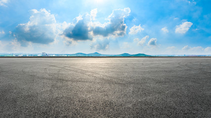 Wide race track and city suburb skyline on a sunny day in Shanghai,panoramic view.