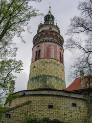 Obraz premium Cesky Krumlov castle tower against the cloudy sky, Czech Republic