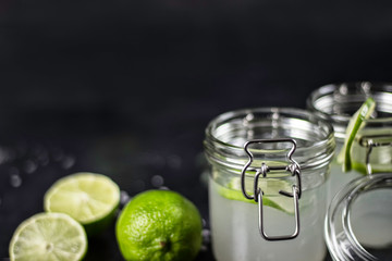 lime juice in glasses on dark stone