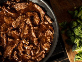 Beef with broccoli vegetables roasted, close up. selective focus. Flat top view, overhead.