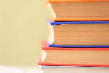 Many books on color background, closeup