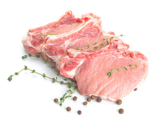 Raw pork meat with spices on white background