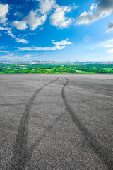 Fototapeta premium Empty race track and city suburb skyline on a sunny day in Shanghai.