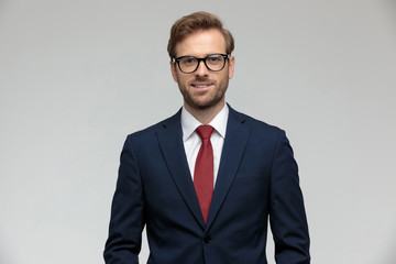 businessman standing and looking at camera happy