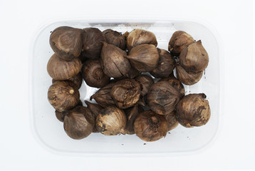 dried black garlic healty isolated on white background
