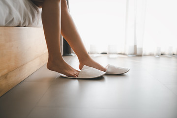 woman legs with slippers - obrazy, fototapety, plakaty