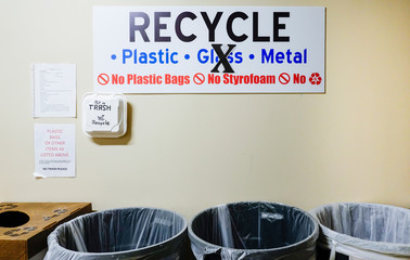 Solomons, Maryland USA A garbage room with recycling bins in a residential complex.