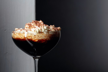 Coffee cocktail with whipped cream.