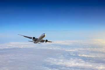 Airplane flying at high altitude and beautiful high-altitude clouds in spring