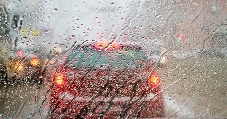 View from the car windscreen during rain and wet snow. Poor visibility while driving around the...
