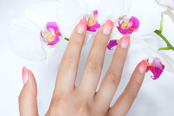 Female hand with a beautiful manicure close up.