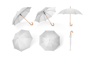 collection of white umbrellas with wooden handle isolated on a white background  mock up