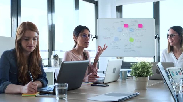 Slow motion shot of businesswomen during meeting in office