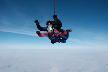 Skydiving. Tandem jump. Winter fun.