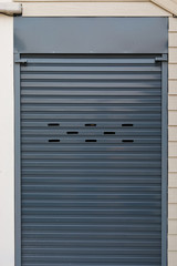 black roller shutter door closed security in house