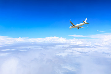 Airplane flying at high altitude and beautiful high-altitude clouds in spring