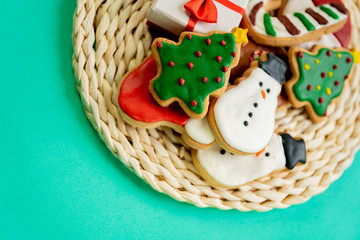 Gingerbread cookies on green  background, concept Christmas.