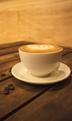 cup of coffee on wooden table