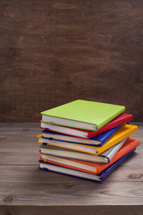 notepad or paper notebook at wooden table