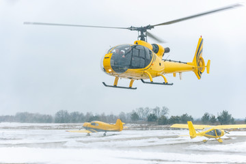 Yellow helicopter take off